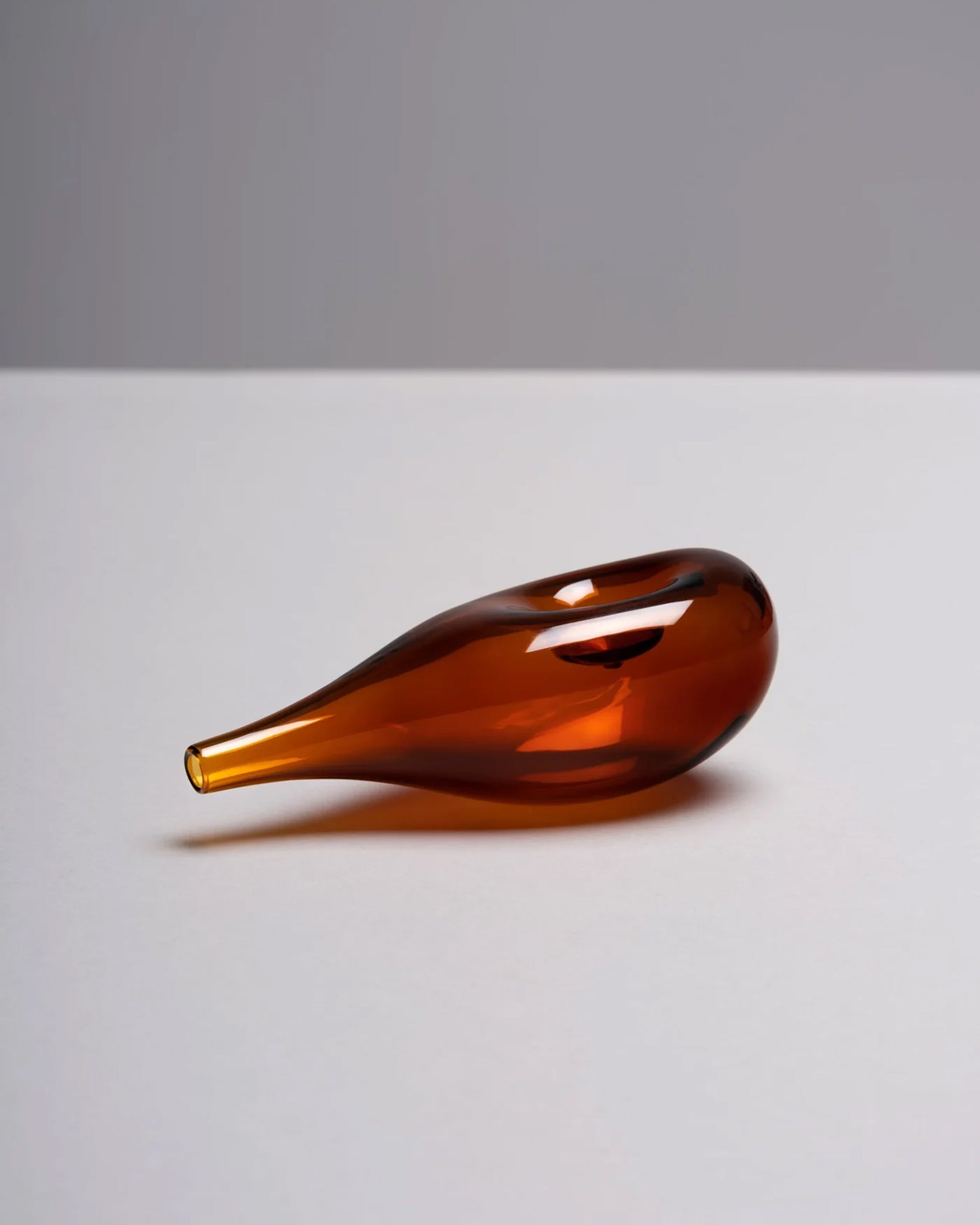 Brown glass Cloud Pipe photographed on a white background to highlight its sculptural, cloud-like form.