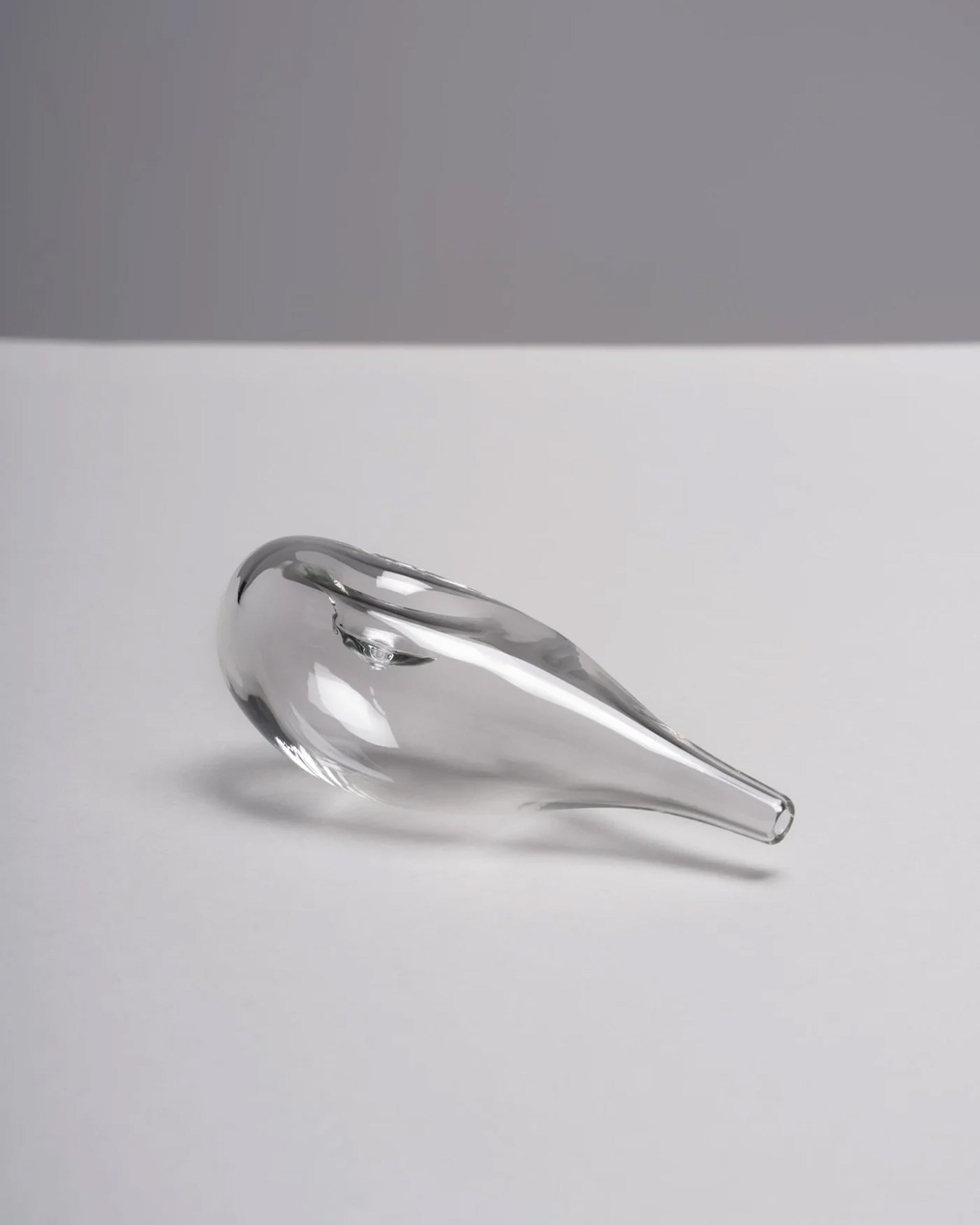 Clear blown glass Cloud Pipe photographed on a white background to highlight its sculptural, cloud-like form.