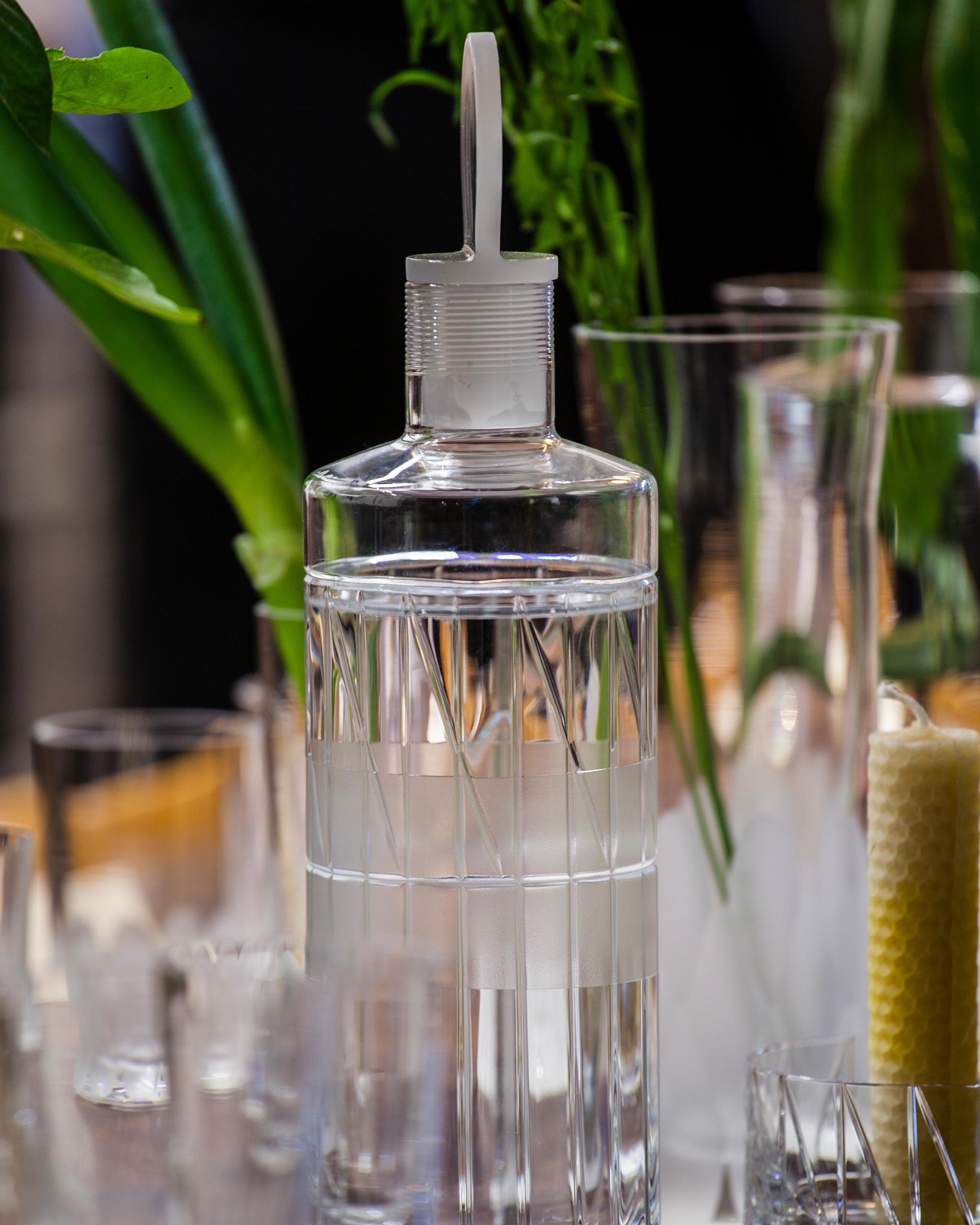 Close image of whiskey decanter and stopper showcasing hand-blown cut crystal detailing.