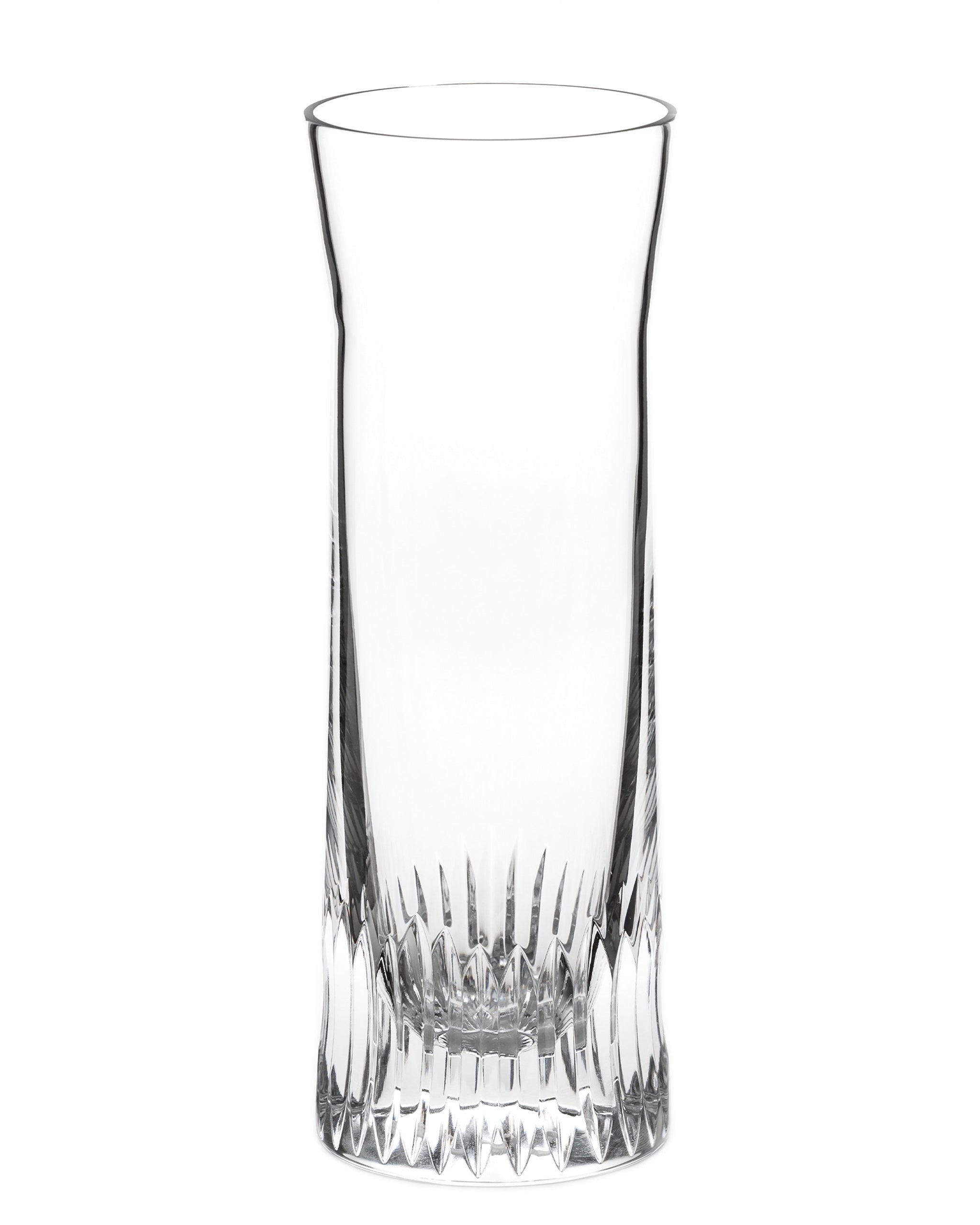 Polished hand-cut Irish crystal carafe glass with deep angular cuts inspired by ploughed soil on a white background