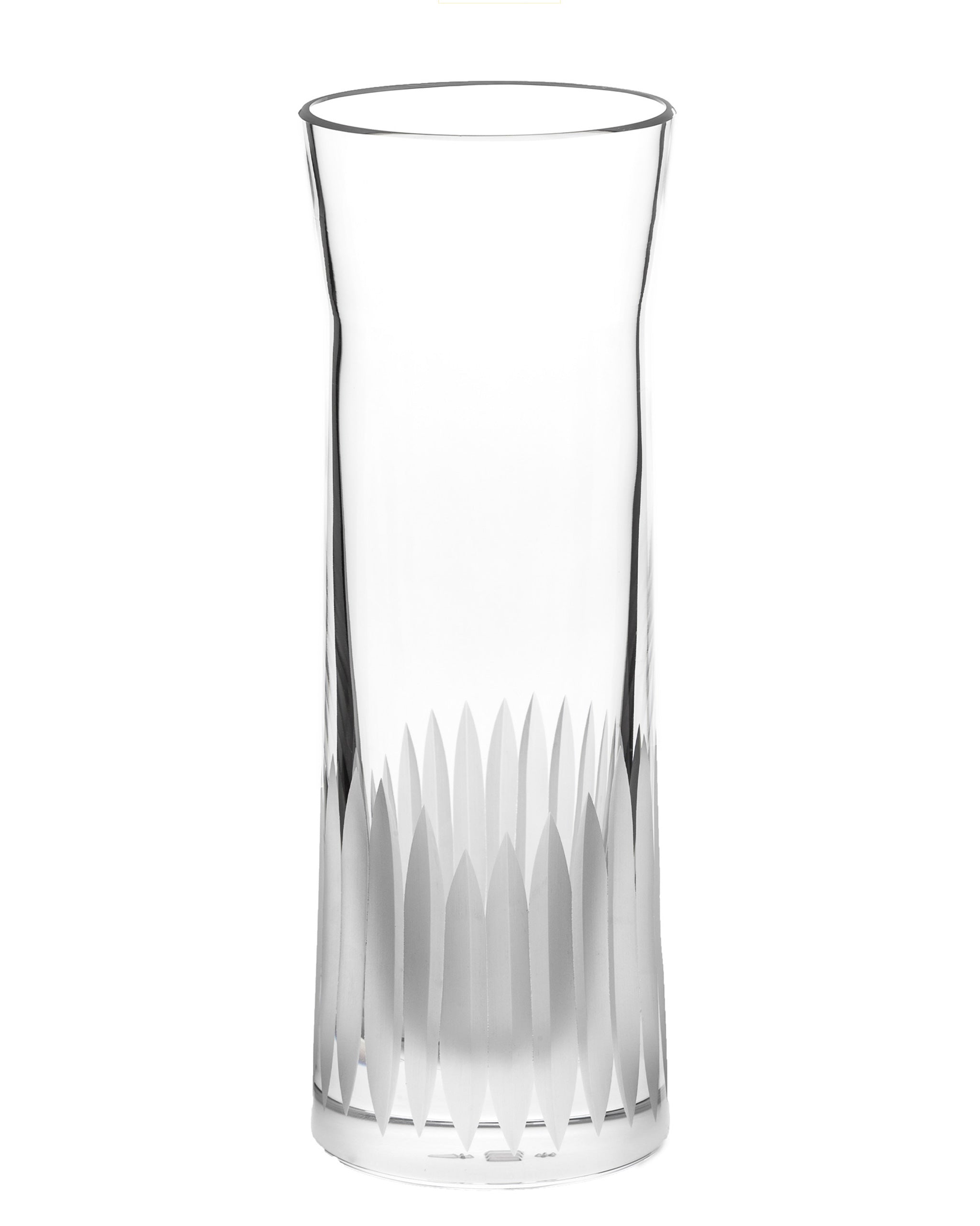 Unpolished hand-cut Irish crystal carafe glass with deep angular cuts inspired by ploughed soil on a white background