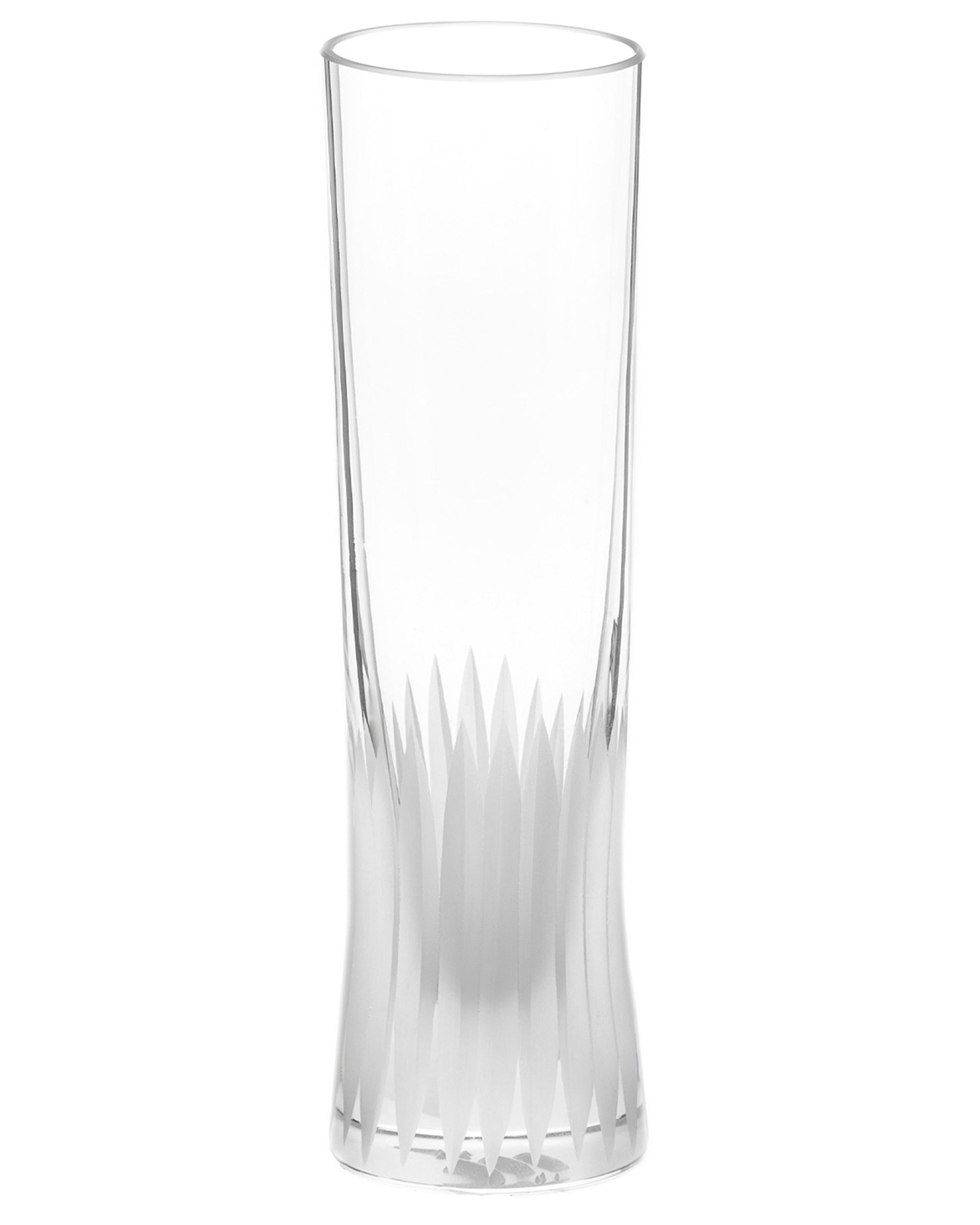Unpolished hand-cut Irish crystal champagne flute with deep angular cuts inspired by ploughed soil on a white background