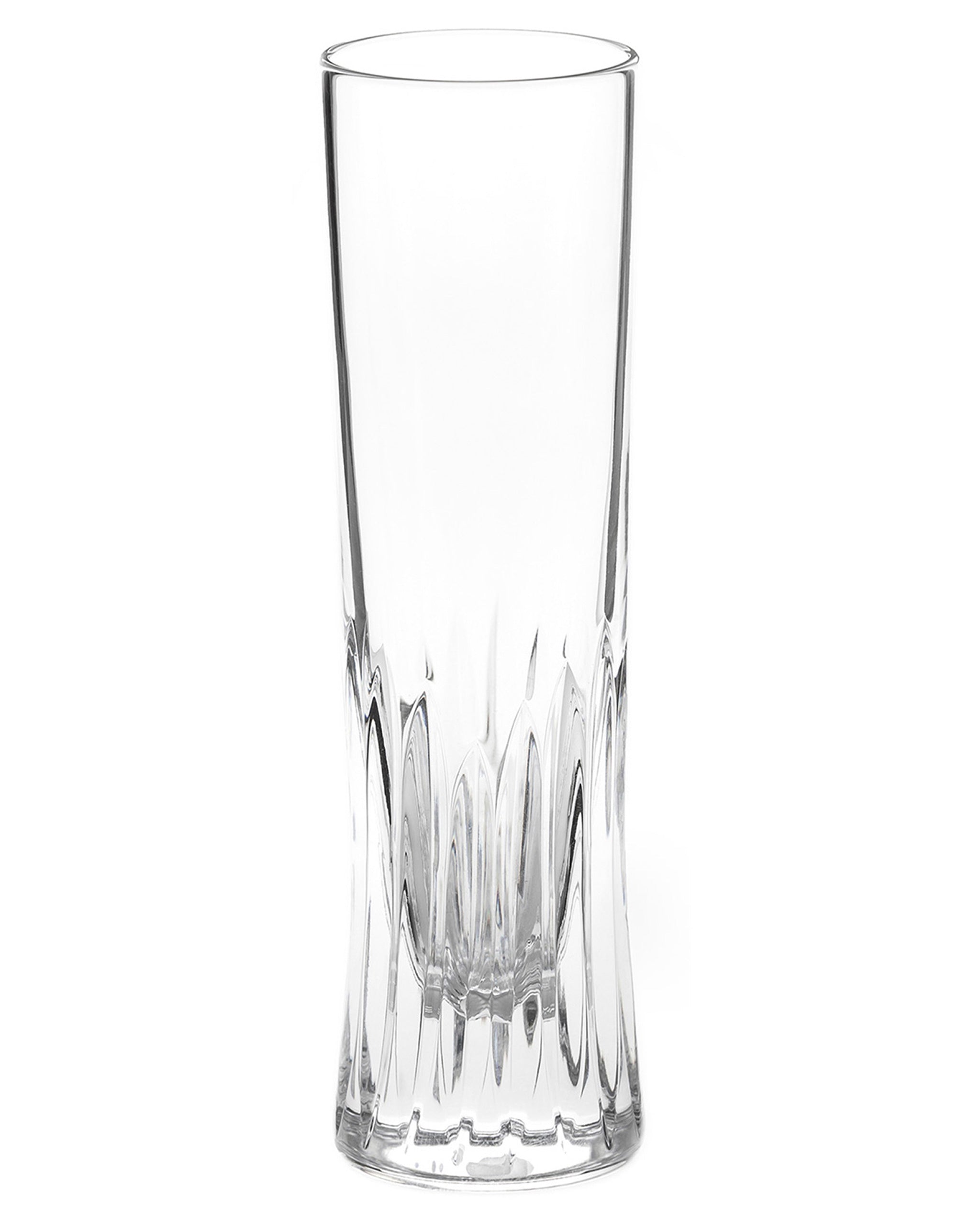 Polished hand-cut Irish crystal champagne flute with deep angular cuts inspired by ploughed soil on a white background