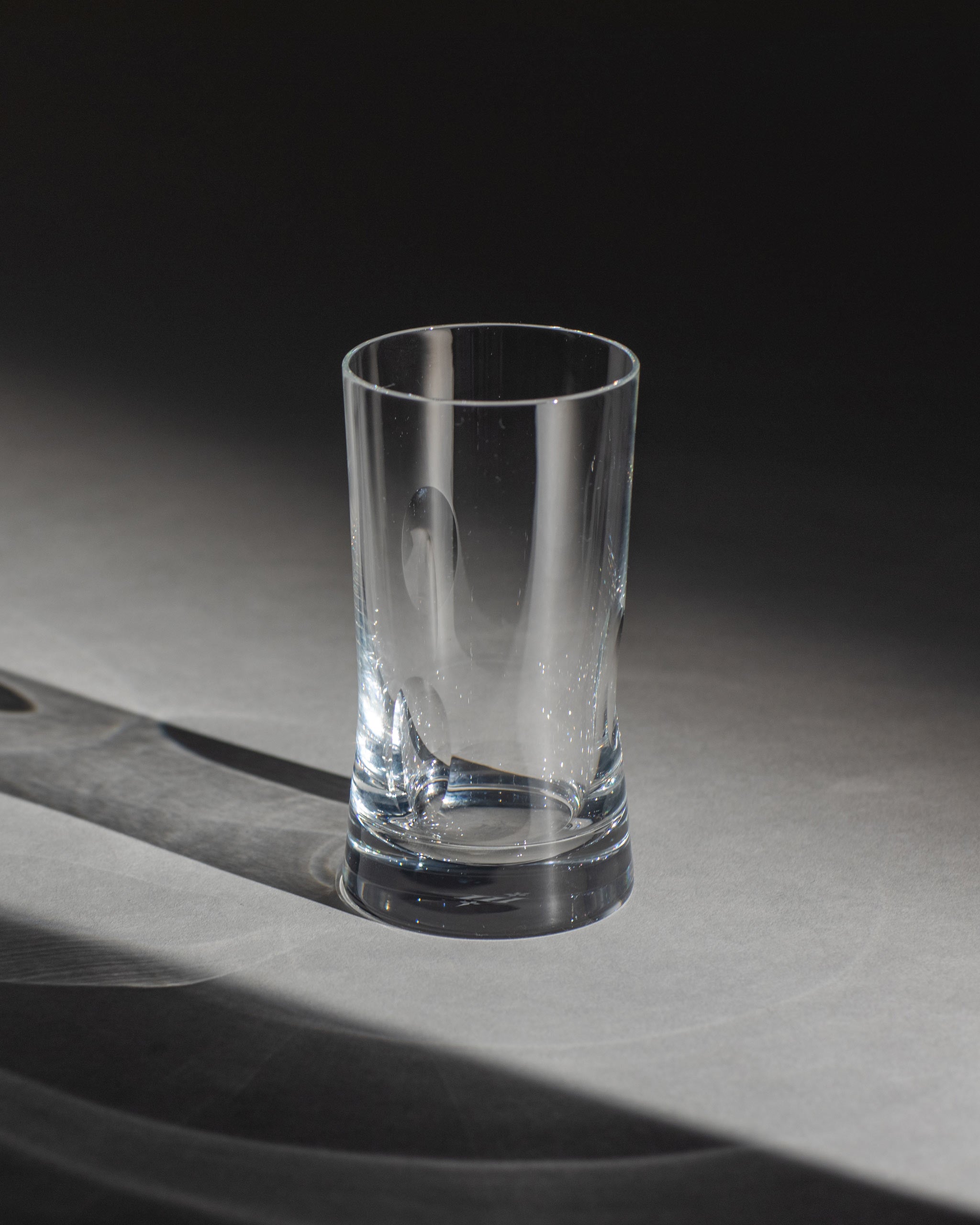 Polished hand-cut Irish crystal rocks tumbler glass with softly polished and sandblasted dew-cut detailing on a white background