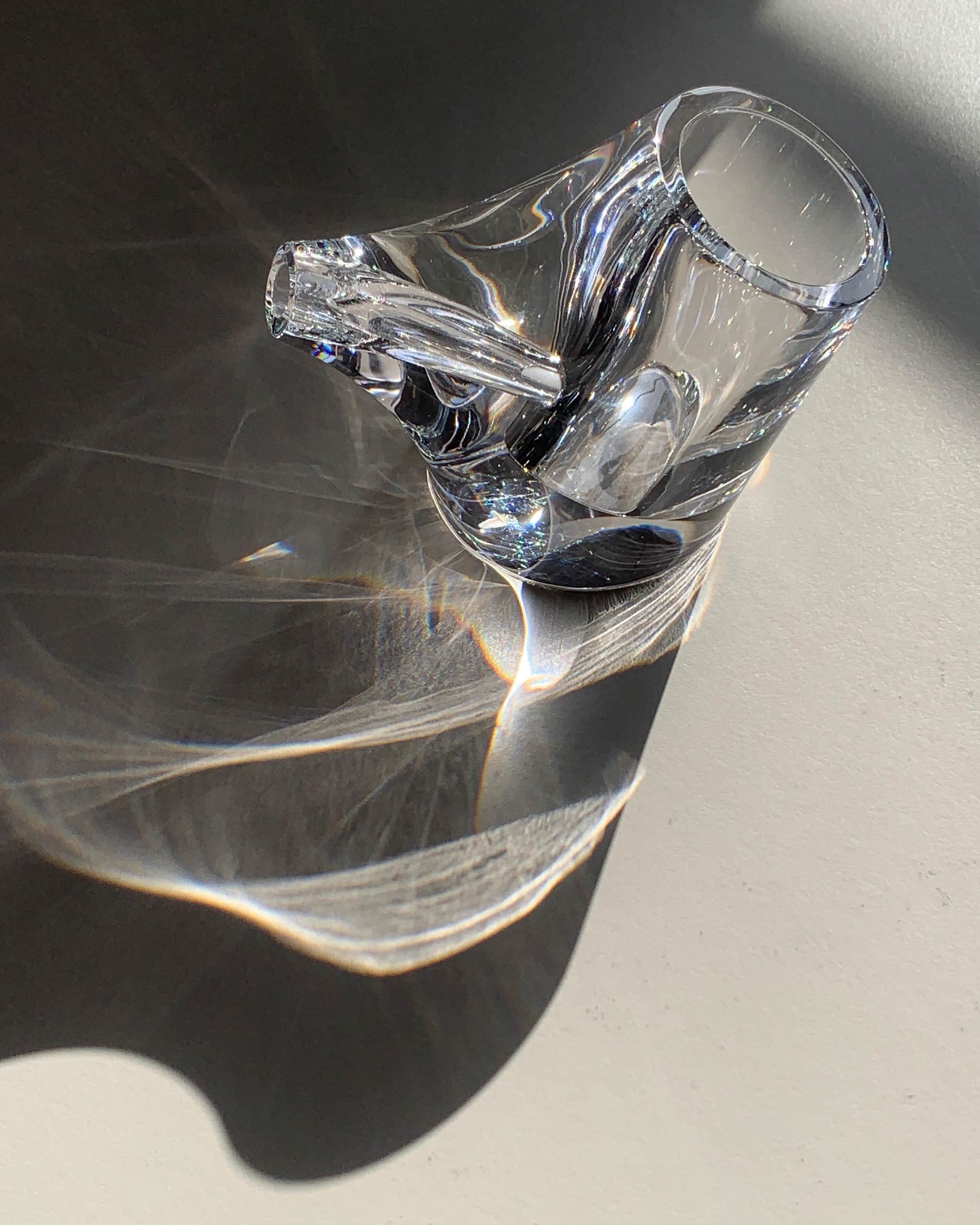 HopStep pot in lead crystal glass perfect for oil, sake, tea or infusing shown with light passing through to highlight details