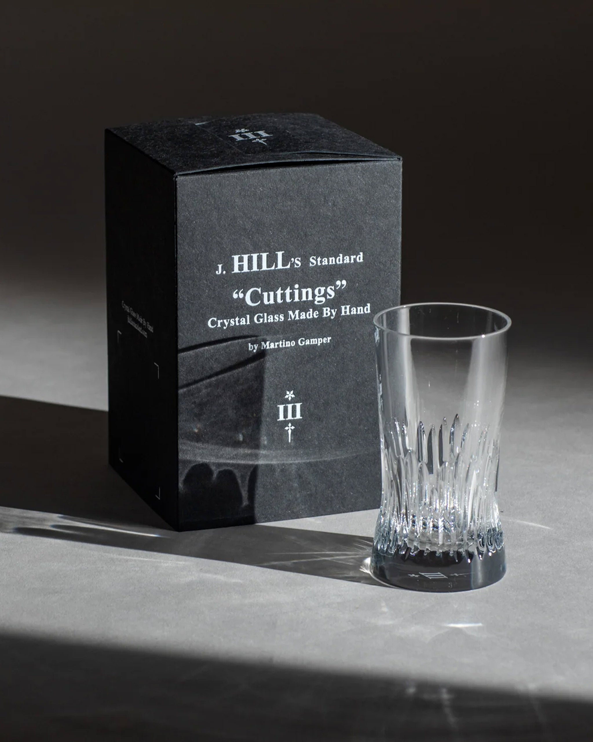 Irish hand-blown cut crystal glass alongside matt black branded packaging