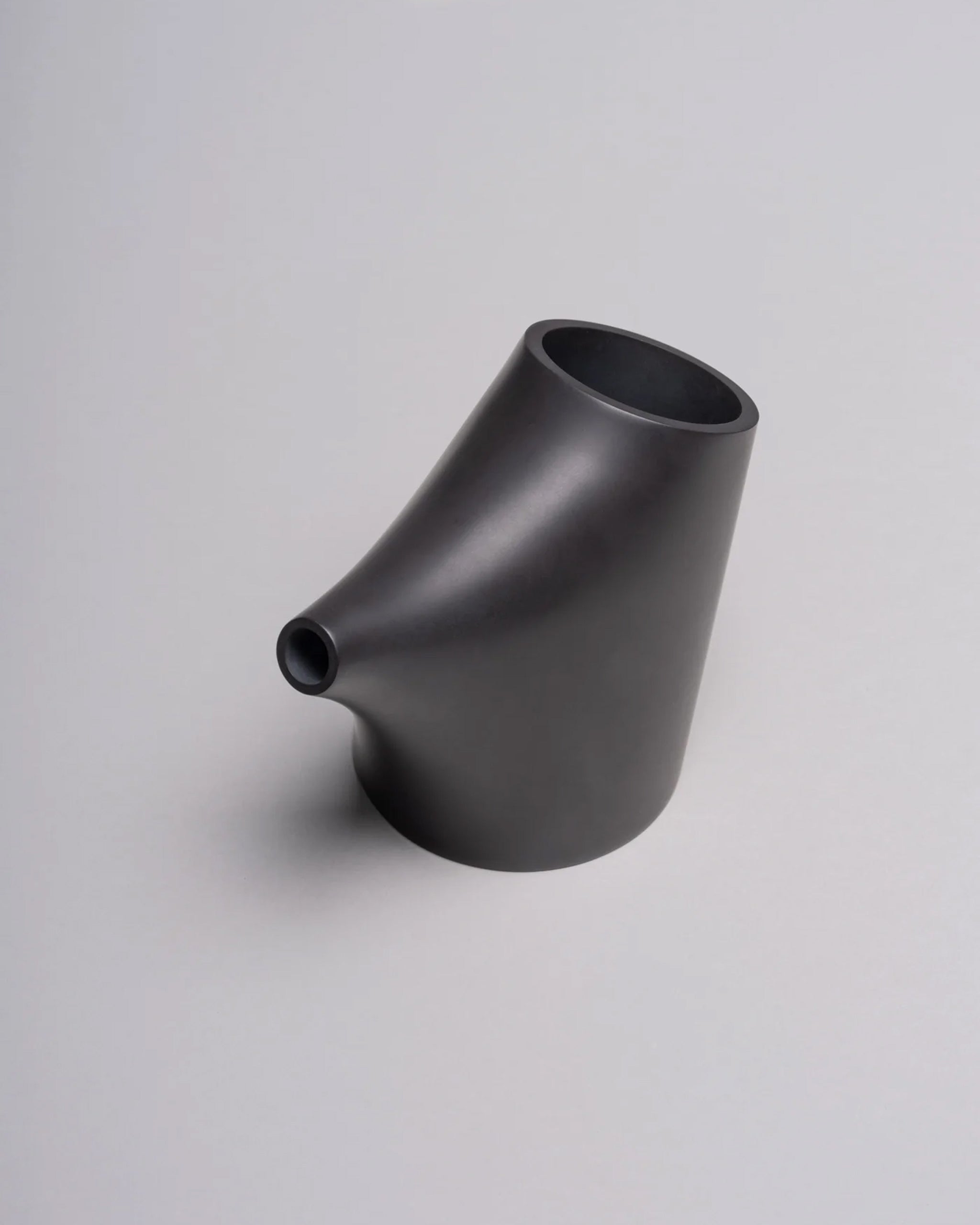 HopStep pot in noir porcelain perfect for oil, sake, tea or infusing shown on a white background.