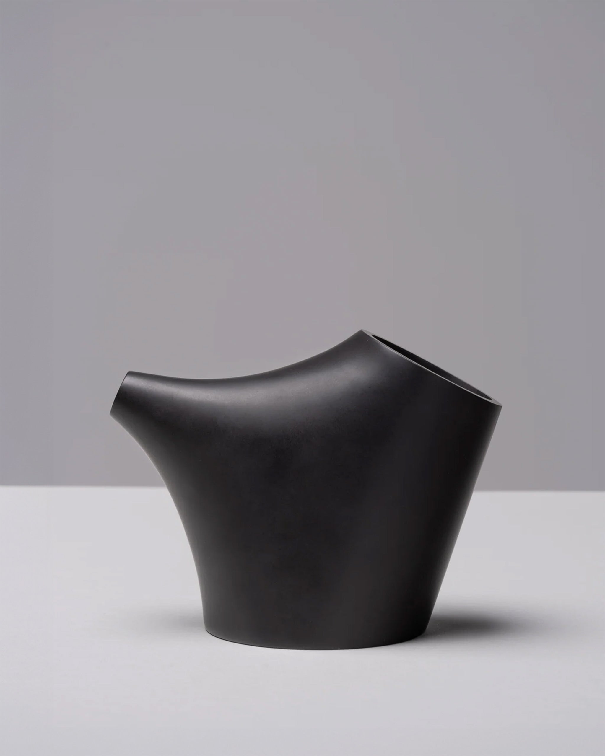 HopStep pot in noir porcelain perfect for oil, sake, tea or infusing shown on a white background.