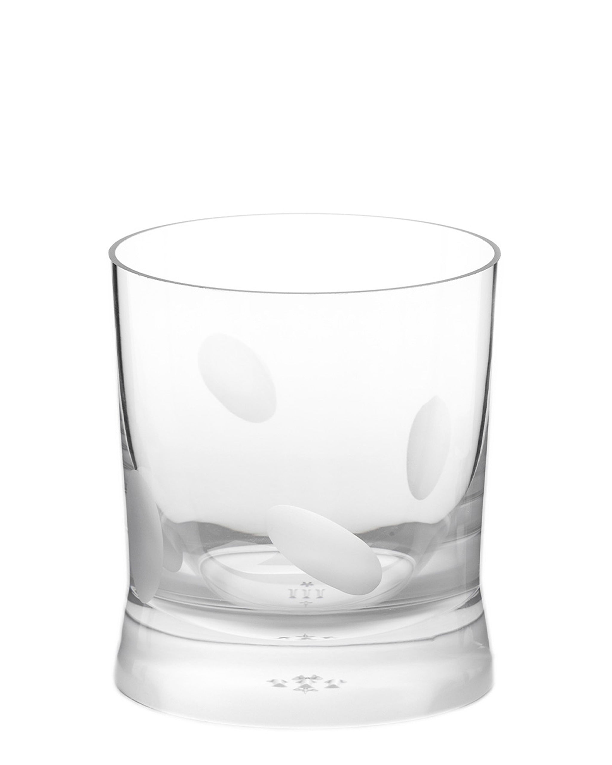 Unpolished hand-cut Irish crystal whiskey low glass with softly polished and sandblasted dew-cut detailing on a white background