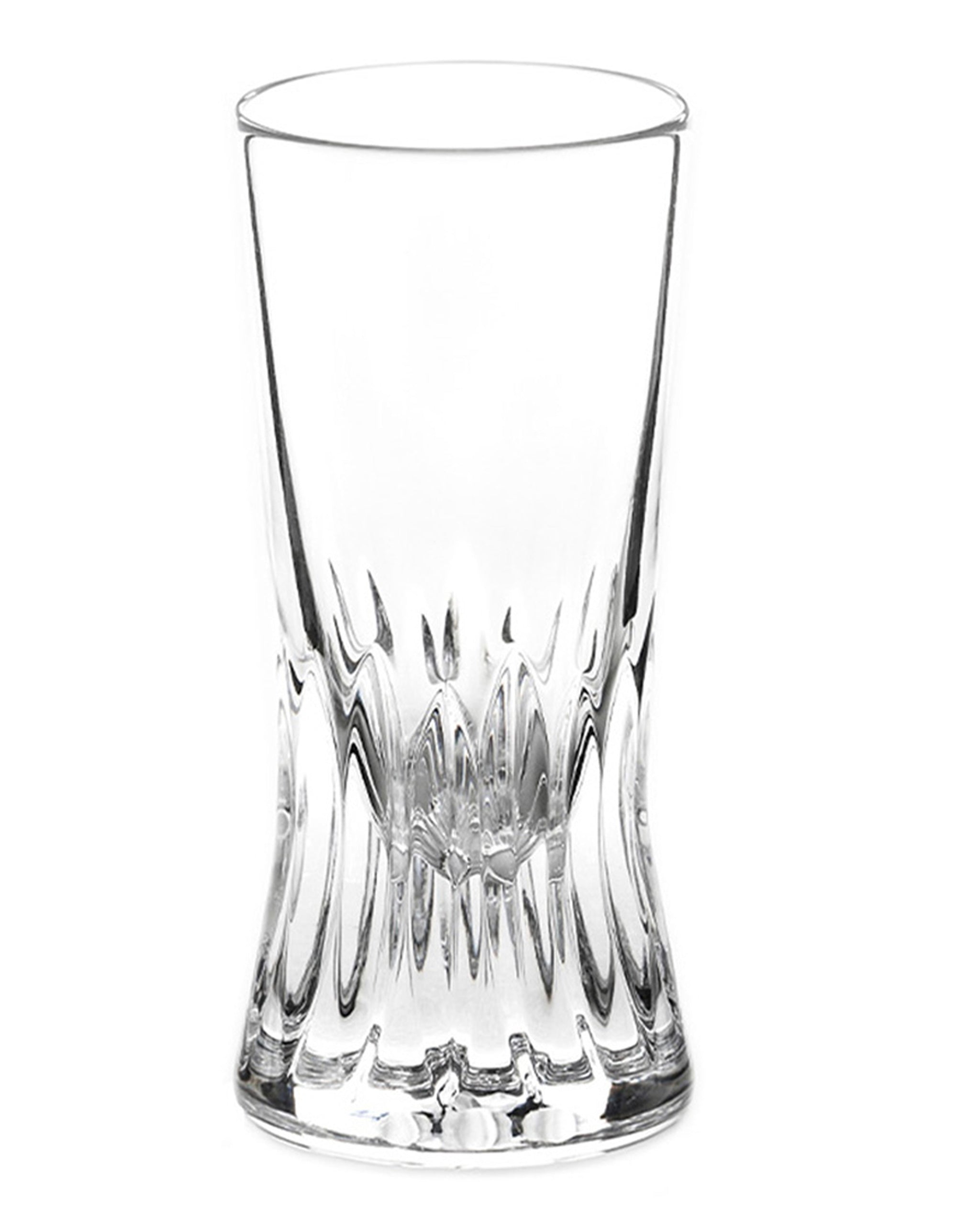 Polished hand-cut Irish crystal shot glass with deep angular cuts inspired by ploughed soil on a white background