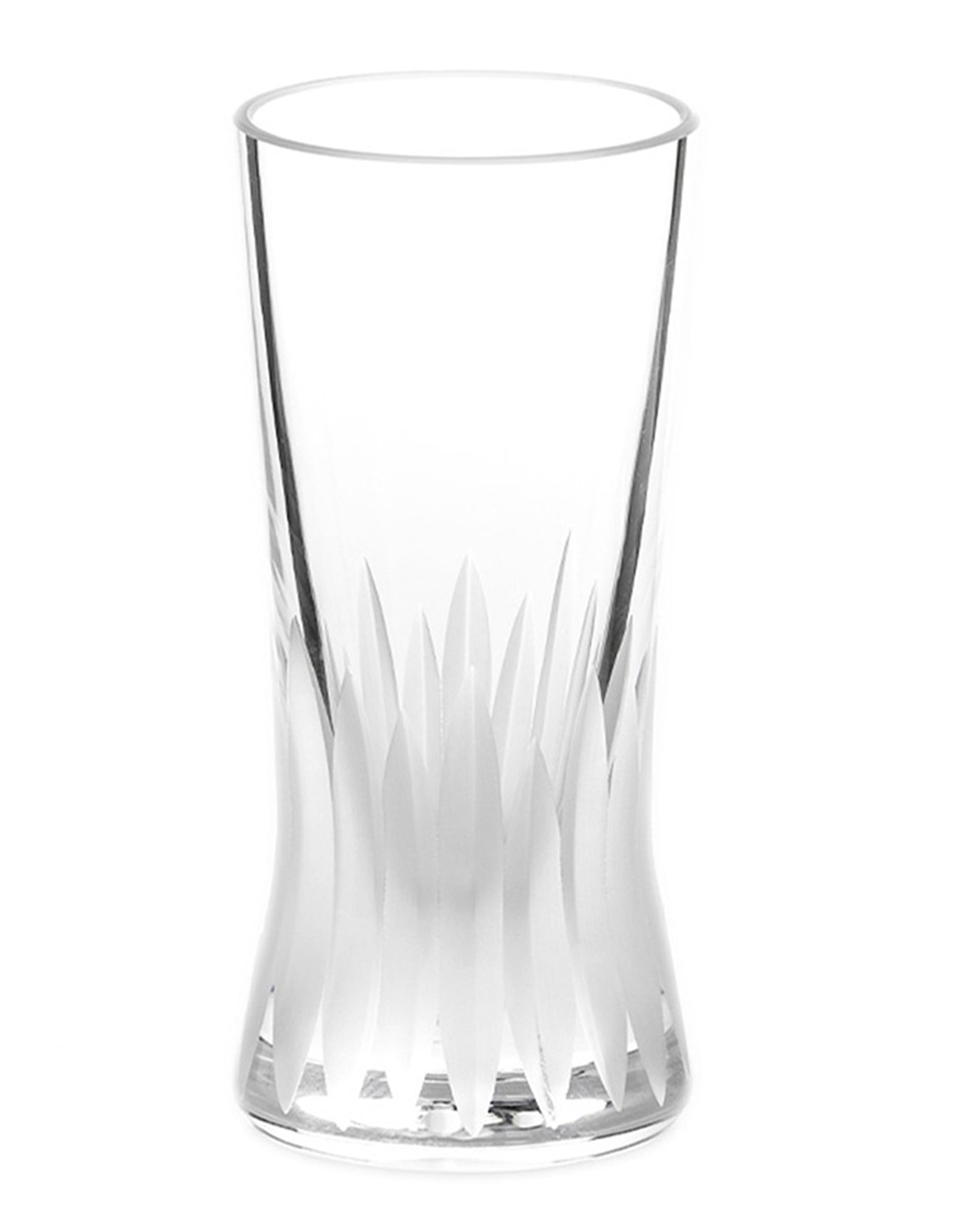 Unpolished hand-cut Irish crystal shot glass with deep angular cuts inspired by ploughed soil on a white background