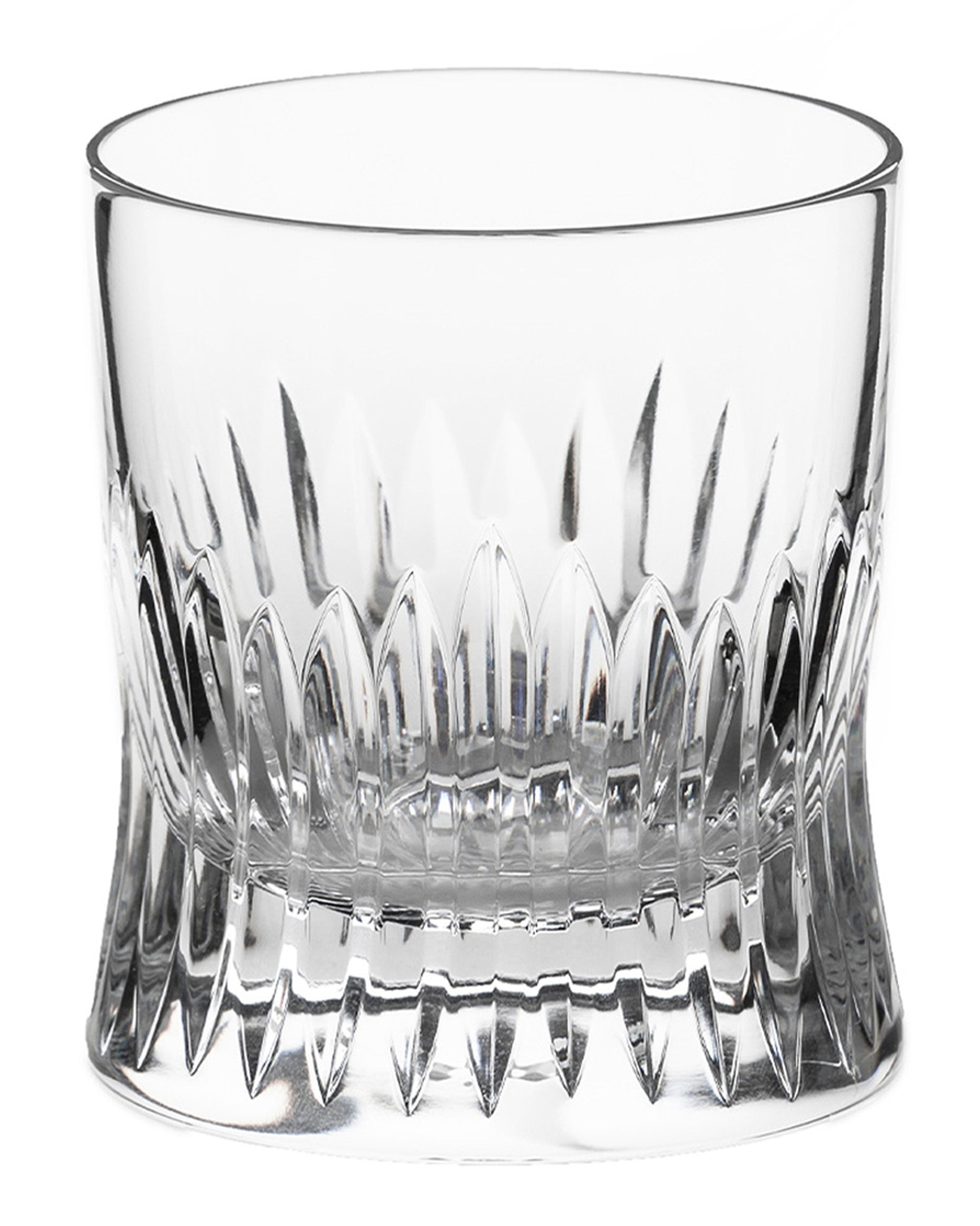 Polished hand-cut Irish crystal whiskey glass with deep angular cuts inspired by ploughed soil on a white background