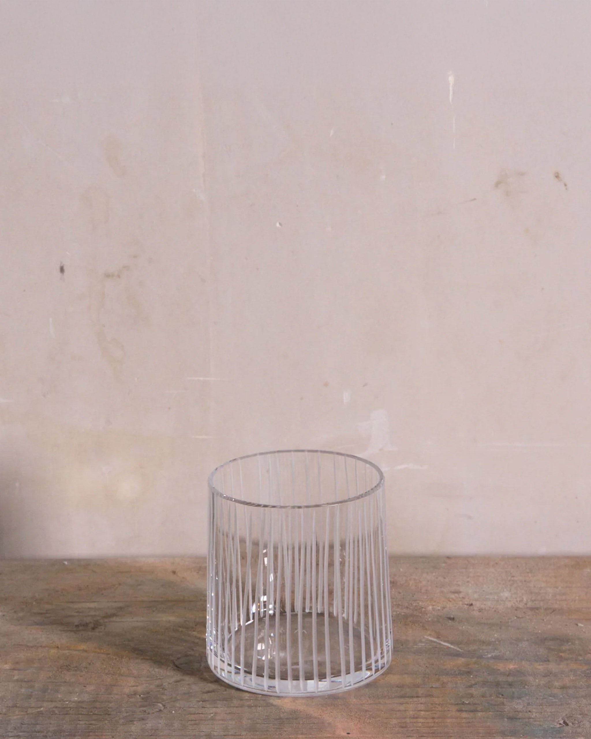 Slant-sided hand-cut Irish crystal tumbler with vertical line pattern from the Row Collection, designed with symmetry and Japanese restraint, perfect for whiskey, wine, or sake.