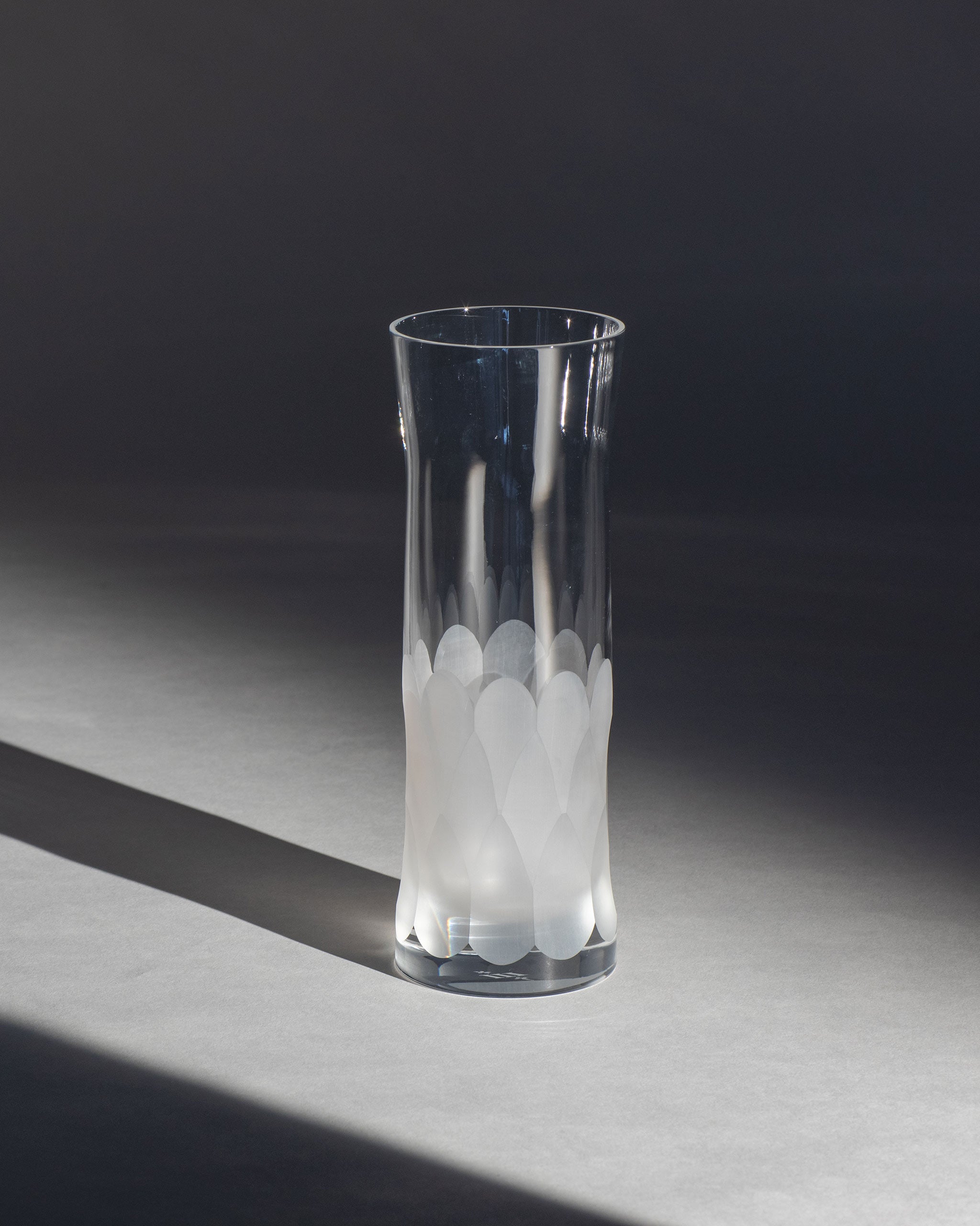 Unpolished Irish hand-blown cut crystal carafe glass, perfect for wine or as a vase, on an ambient background