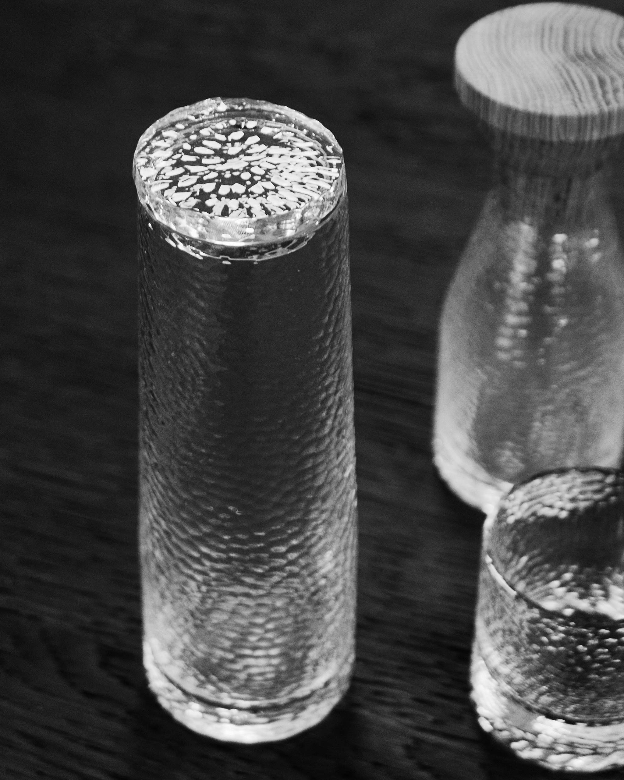 Hand-cut Irish crystal decanter with diffused, tactile surface and broad base, ideal for whiskey, wine, sake, or cocktails.