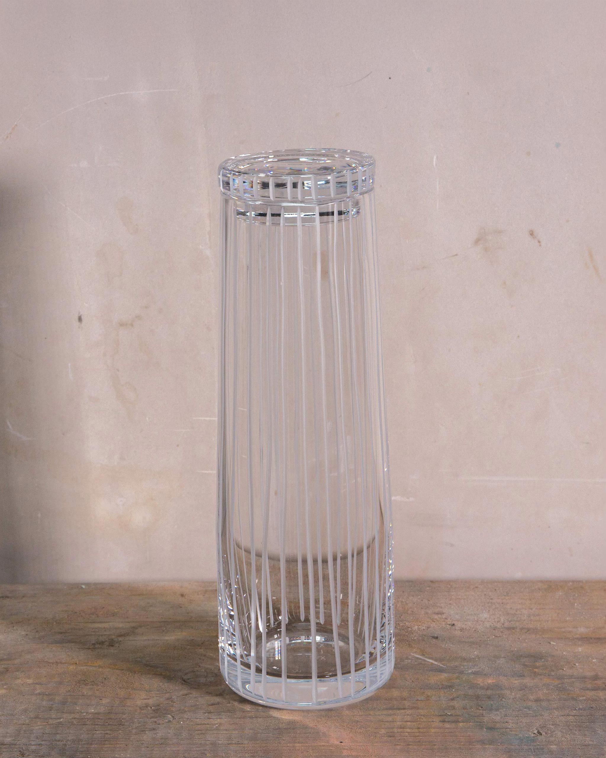 Hand-cut Irish crystal decanter with structured vertical cuts and broad base from the Row Collection, ideal for wine, sake, or cocktails.