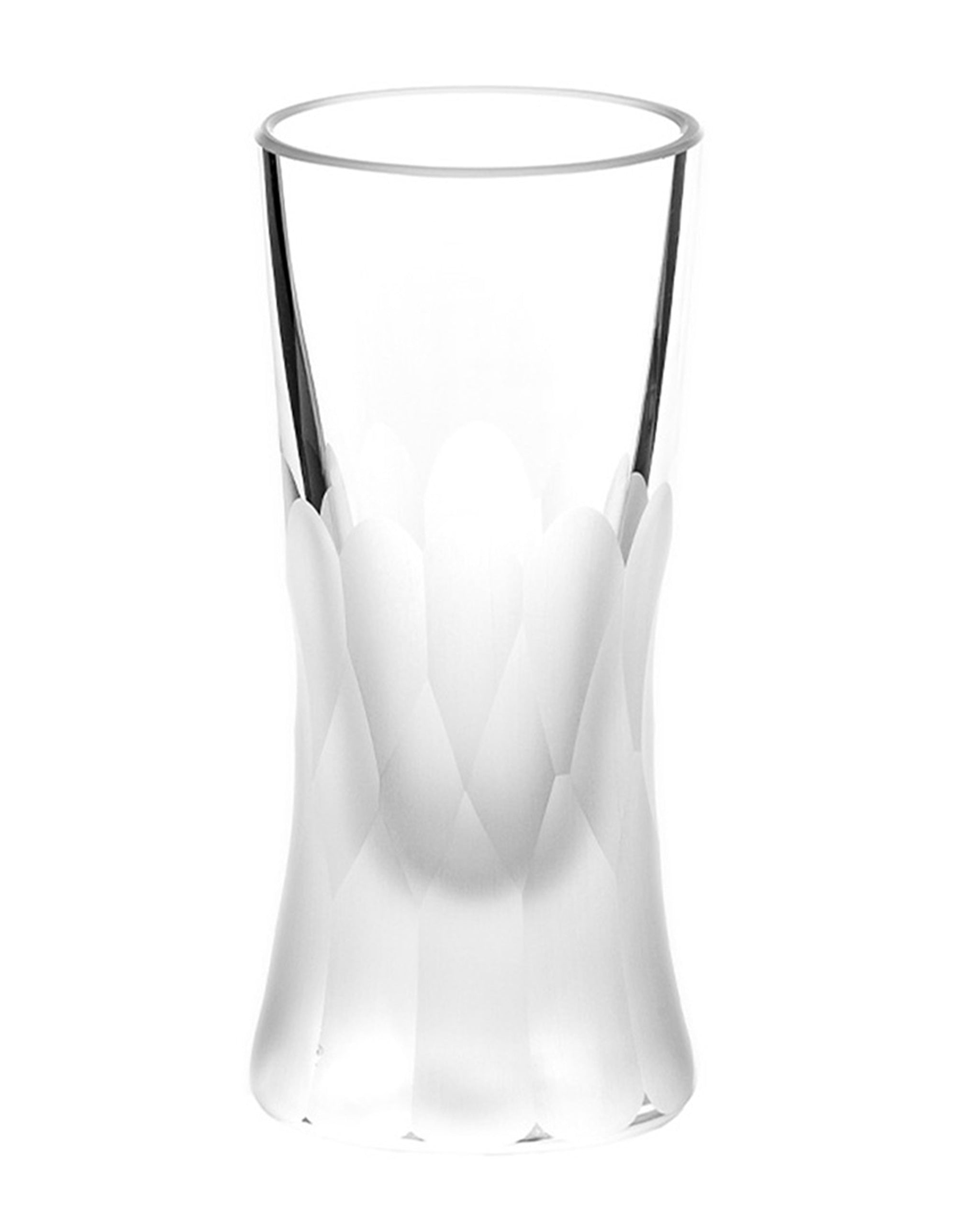 Unpolished Irish hand-blown cut crystal shot or grappa glass with large cut pattern detailing on a white background
