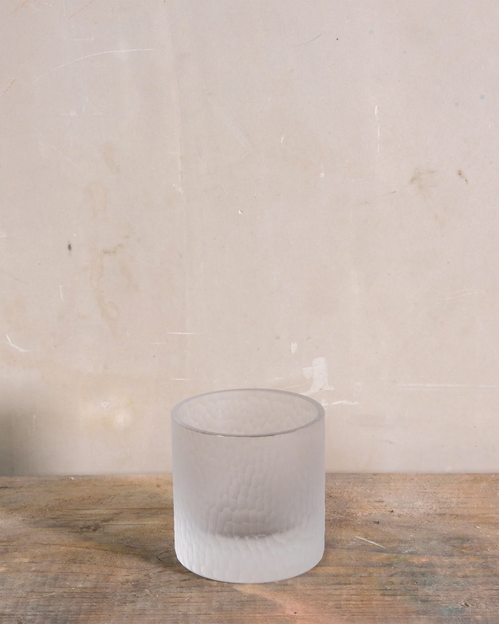 Hand-cut Irish crystal straight tumbler with softly diffused, rounded cuts, ideal for whiskey, wine, or sake on a natural background