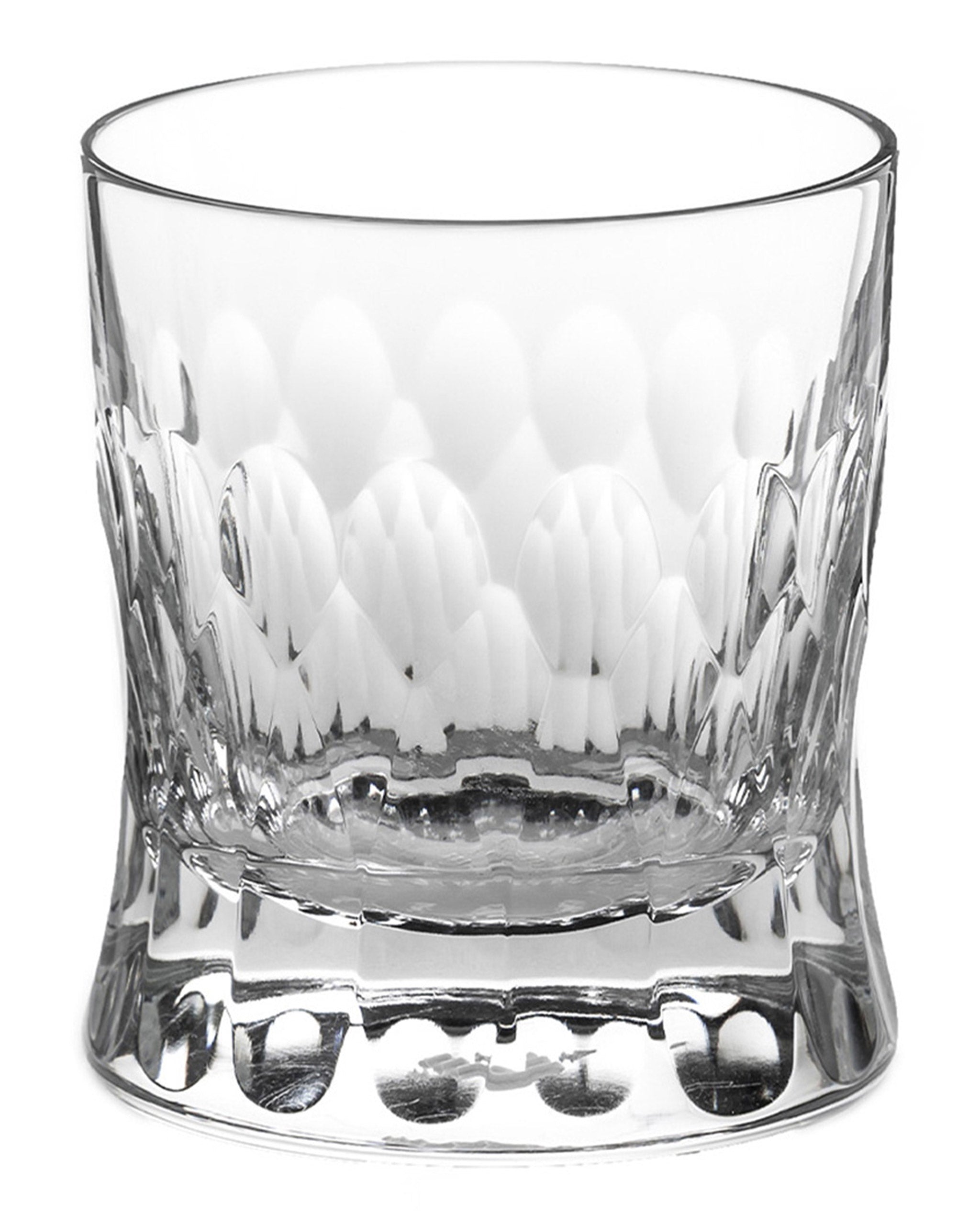 Polished Irish hand-blown crystal whiskey glass, with cut patterns on a white background.